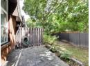 Fenced backyard with a patio area