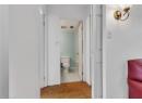 Bathroom featuring toilet and light tile patterned flooring