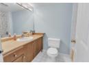 Bathroom featuring light tile patterned floors, vanity, and shower / tub combo