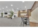 Dining area with recessed lighting and light colored carpet