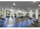 Workout area with recessed lighting and expansive windows