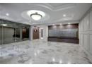 Common area with coffered ceiling and recessed lighting