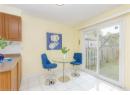 Dining room with light tile patterned floors and baseboards
