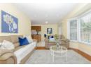 Living room featuring light wood-style flooring and recessed lighting