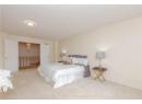 Carpeted bedroom featuring a textured ceiling