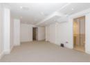 Basement featuring light carpet and recessed lighting