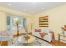 Living room with wood finished floors and recessed lighting