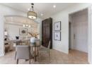 Dining room with recessed lighting, arched walkways, a chandelier, and light tile patterned flooring