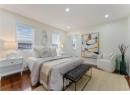 Bedroom with wood finished floors and recessed lighting