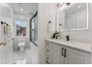 Full bath featuring marble finish floors, vanity, shower / bath combination with glass door, and recessed lighting