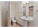 Bathroom with toilet and tile patterned flooring