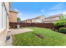 Fenced backyard featuring a residential view and a patio area