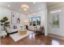 Living area with hardwood / wood-style floors and recessed lighting