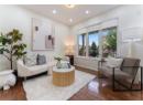 Living area with hardwood / wood-style floors and recessed lighting