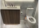 Bathroom featuring vanity, tile walls, and light marble finish flooring