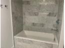 Bathroom featuring tiled shower / bath