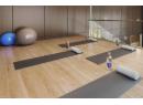 Workout area featuring wood finished floors