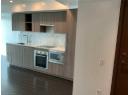 Kitchen featuring backsplash, appliances with stainless steel finishes, modern cabinets, light stone counters, and dark wood finished floors